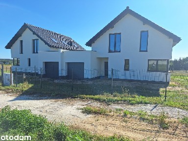Dom bliźniak z garażem w stanie surowym