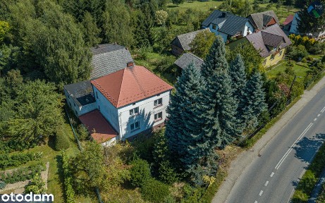Dom na dużej działce z zabudowaniami gospodarczymi