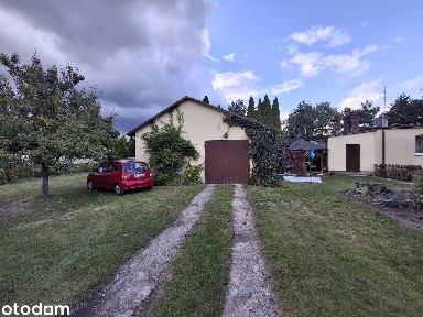 Parterowy dom (bliźniak) 85,6 m² na działce 966 m² z dużym garażem