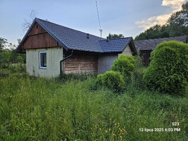 Dom i działka z zabudowaniami