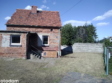 Sprzedam dom z ogrodem i działką blisko miasta.