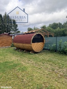 Działka z dwoma domkami nad jeziorem Roś
