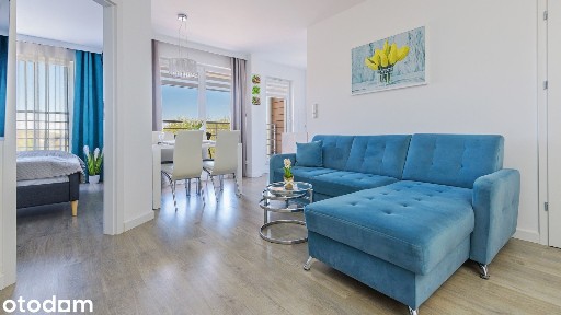 Stylowy apartament z balkonem i widokiem na zieleń i latarnie morską