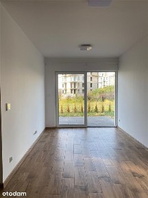Dwupokojowe mieszkanie z ogródkiem i halą garażową