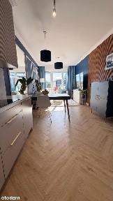 Słoneczny apartament o wysokim standardzie na ostatnim piętrze