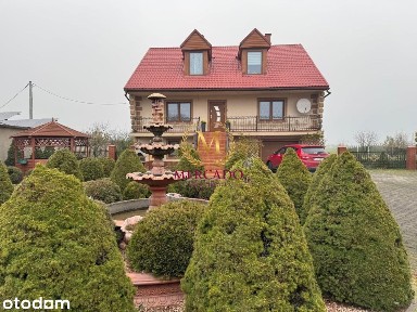 Samowystarczalny dom z ogrodem i stawem