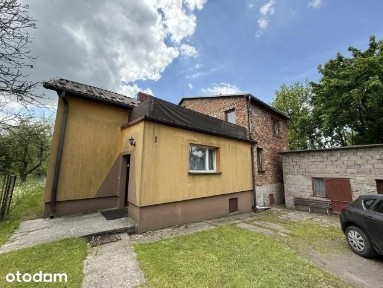 Udział 1/2 w dwóch domach i garażu