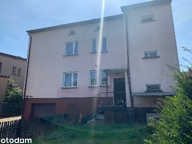 Syndyk sprzeda udział w wysokości 6/8. Dom z garażem.