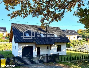 Nowoczesny dom dla rodziny z garażem i ogrodem.