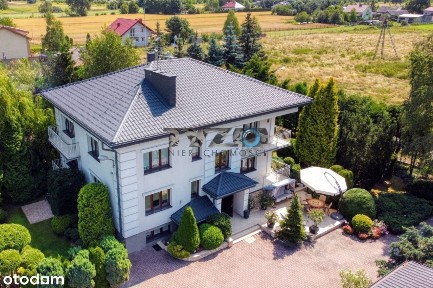 Dombiuromagazyn1 ha18 km od granic W-wy